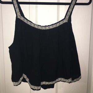 Black and cream colored cropped tank top
